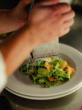 Green pasta with orange sauce 