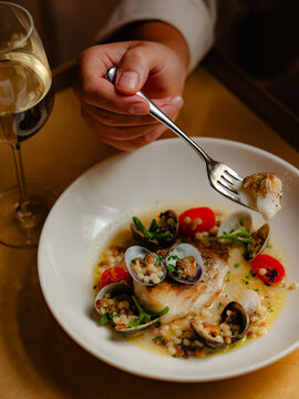 White fish with mussels and cous cous