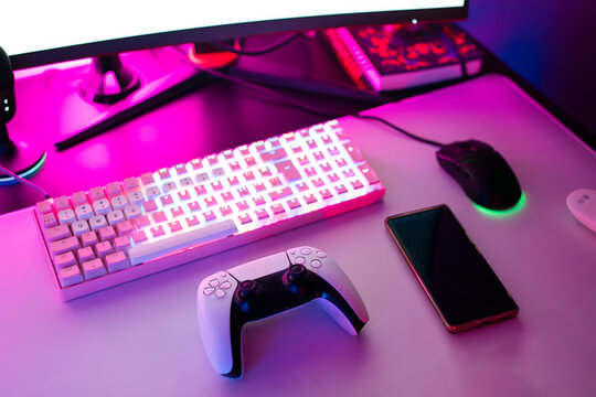 Smart phone and Gaming Equipment on desk