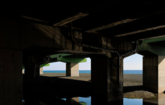 Bridge-Bottom Viewport: A Coastline Deconstructed by Concrete.