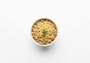 Bowl of uncooked quinoa with parsley garnish on white background minimalist food
