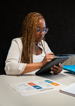 Woman using tablet in modern office setting