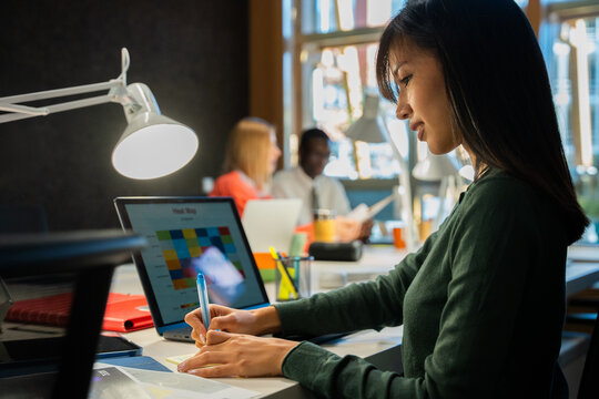 Focused professional working at a shared office space