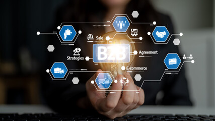 Fototapeta premium A professional holds a digital globe symbolizing B2B concepts. Various icons represent strategies, agreements, e-commerce, and sales, illustrating modern business interactions. Tessel