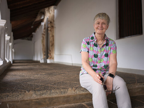 Tourist Sitting at Dambulla Cave Temple