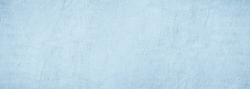 Light blue white concrete cement wall grungy surface texture background. Pale soft muted pastel shade. Painted plaster. Simple minimal. Blank empty template design. Christmas winter cold. Wide banner.