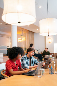 Diverse team collaborating in a modern coworking space