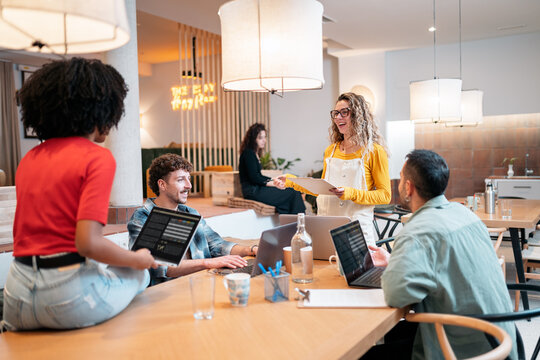 Diverse team collaborating in a modern coworking space