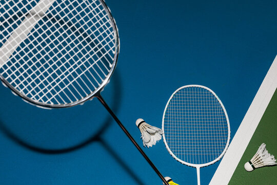 Badminton Rackets and Shuttles In Action on the Sports Court