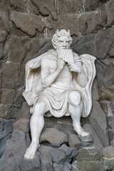 Obraz premium Classical stone statue playing pan flute