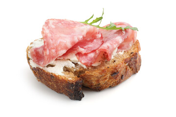 Fototapeta premium Delicious bruschetta with salami sausage, cream cheese and arugula isolated on white