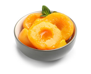 Pickled peaches and mint leaves in bowl isolated on white © New Africa