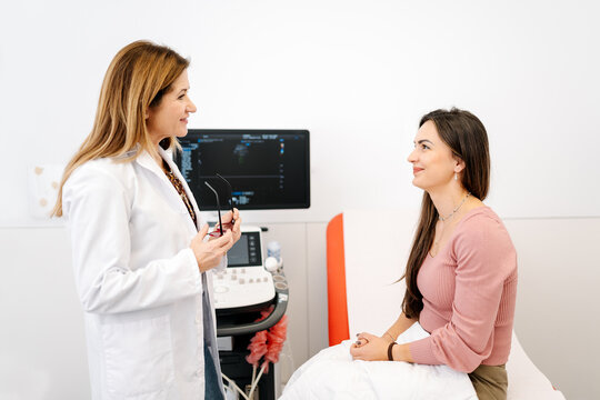 Doctor discussing medical information with patient in consultation