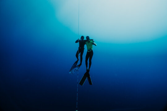 two freediver having fun dive