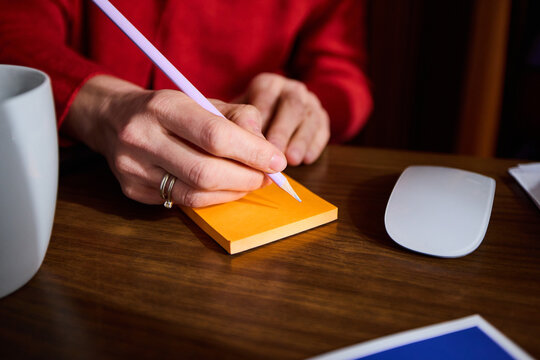 Anonymous woman writes a note