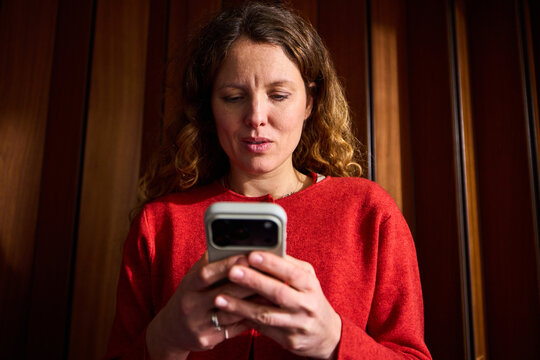 Busy woman send texts via her phone
