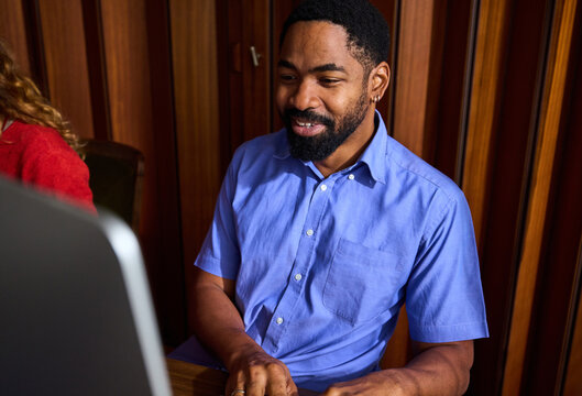 Smiling man sitting in the office