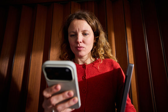 Busy woman send texts via her phone