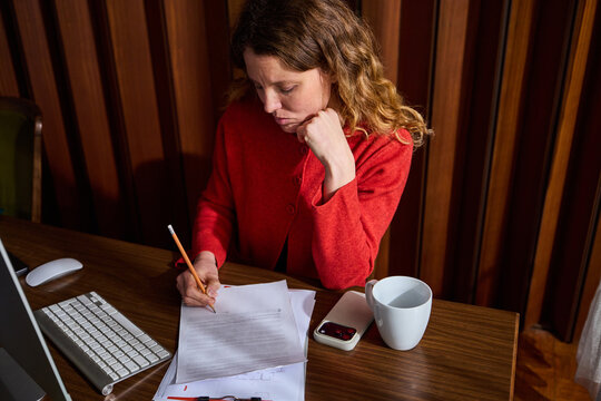 Woman fills out the paperwork.