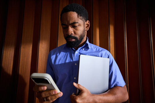 Busy man with technical devices