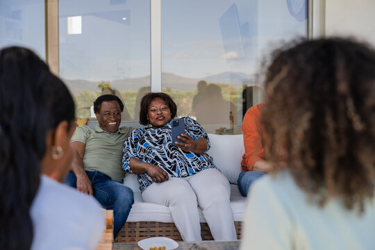 Family enjoying quality time together on a sunny patio