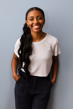 Smiling woman with long hair in casual attire