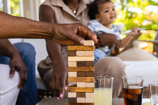 Family bonding over a game of wooden blocks