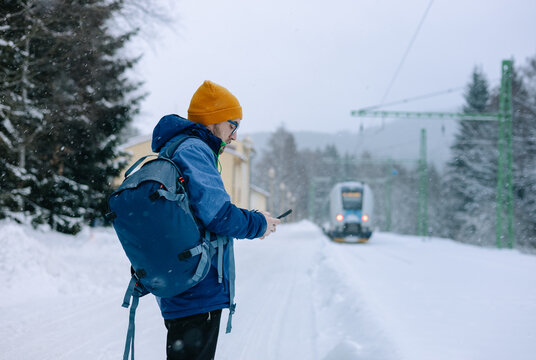 Man on a train station in winter
