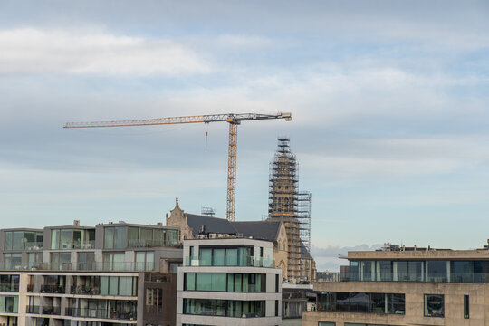 Construction crane over city skyline