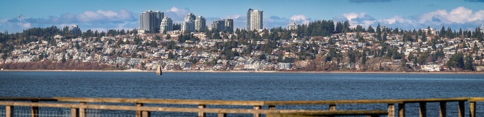 Obraz premium Panoramic view of White Rock, British Columbia which is just over the border from Blaine, WA and Semiahmoo Bay. White Rock is named for a large white boulder on its beach near the promenade.