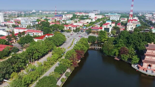 Aerial view of Temple towers on a lake in Hoa Lu Old town, Ninh Binh, Vietnam. The towers are popular tourist destinations for their unique architecture.