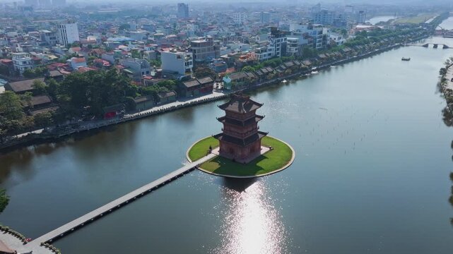 Aerial view of Temple towers on a lake in Hoa Lu Old town, Ninh Binh, Vietnam. The towers are popular tourist destinations for their unique architecture.