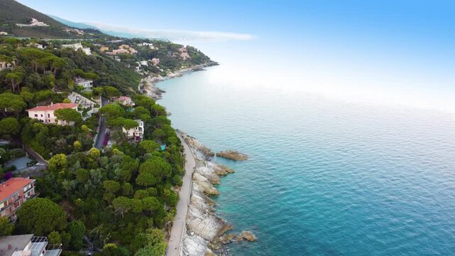 Panoramic aerial view of Varazze, Liguria region, province of Savona, Italy. A beautiful view of the coast surrounded by green hills l Beigua regional natural park, UNESCO geopark. 