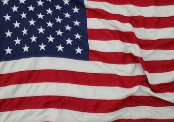 Fototapeta premium The iconic american flag waving in the wind with stars and stripes clearly visible.