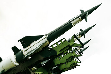 Obraz premium missile with a warhead isolated on white background. Weapons of mass destruction, chemical, nuclear. artillery set of rocket bomb rocket to launch. Missiles with warheads. War, fire, attack, threat.