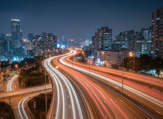 Obraz premium Vast Cityscape At Night With Streaking Car Lights On A Multi Level Highway Reflecting Urban Energy And Progress