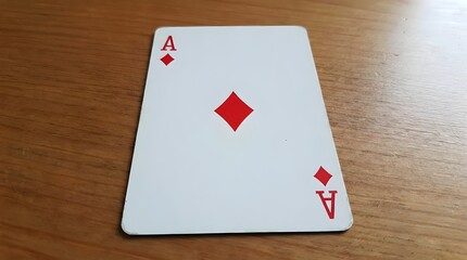 Ace of diamonds playing card on wooden table