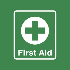 Fototapeta premium First Aid Sign on Green Background with White Cross and Text