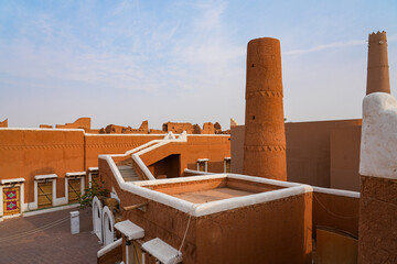 Traditional Najdi mud brick tower with geometric carvings in Shaqra, Saudi Arabia