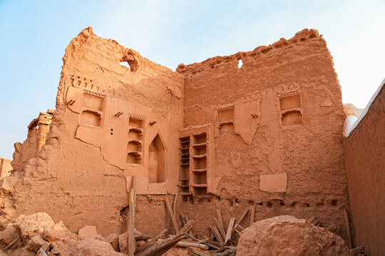 Ancient mud brick ruins and decorative wall niches in the historic village of Shaqra in Saudi Arabia