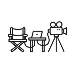 A director's chair, laptop, and camera setup on a film set from a straight-on viewpoint