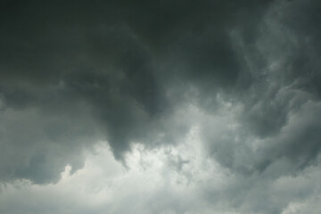 Black cloudy abstract pattern and texture background clumping in the sky. Hurricane during the day.Climate and weather concept. Copy space for text. For graphic design, 3D rendering and banners