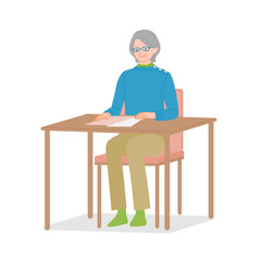 Senior woman taking document out of clear file at desk