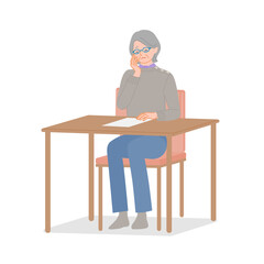 Senior woman putting document down and thinking at desk