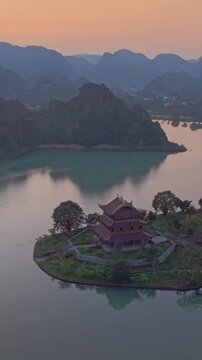 Aerial view of Chua Vang Pagoda, a popular destination for tourists and locals alike, in  Ninh Binh, Vietnam. The pagoda is known for its beautiful architecture.