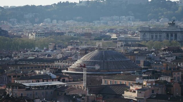 Panoramic aerial shot of iconic temple of Pantheon built in 118 to 125 A.D. with a dome and renaissance tombs, including Raphael's, Rome historic centre, Italy