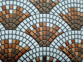 Fototapeta premium Mosaic tile pavement texture in curved geometric pattern grey stone floor background architectural surface detail closeup