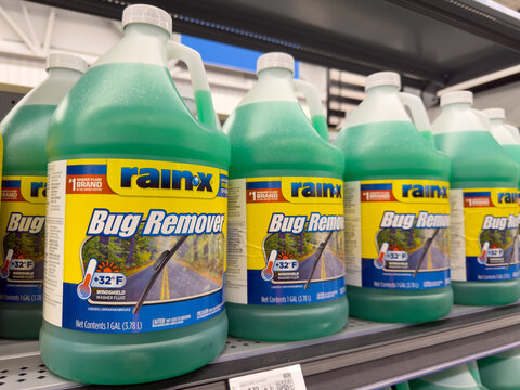 RainX Bug Remover Windshield Washer Fluid Jugs on Auto Parts Store Shelf