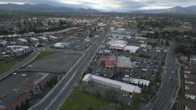 The city of Napa in northern California is shown during an aerial approaching view during a winter, partly cloudy day in real time.