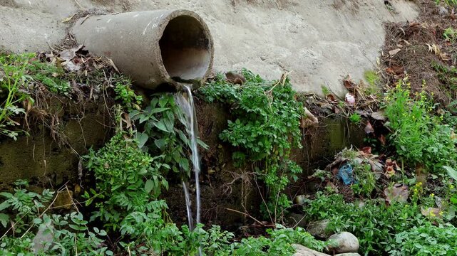 Real time environmental footage showing untreated sewage water flowing directly into the Beas river during winter season in Himachal Pradesh, India.
